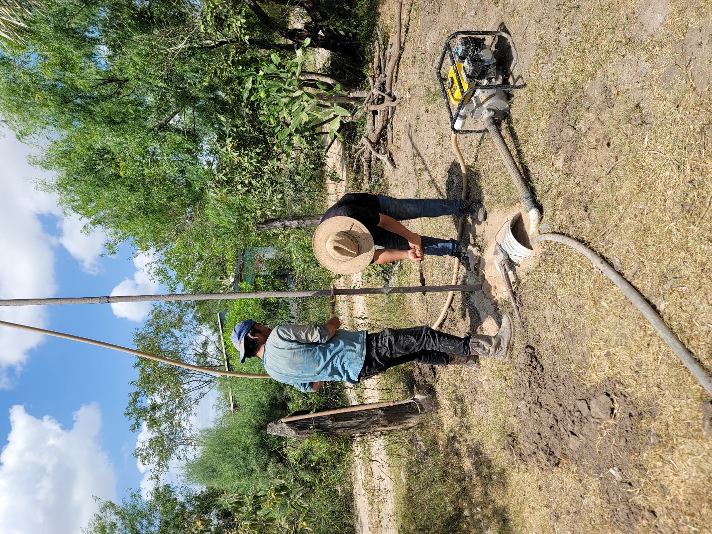 A person standing in a dirt field
AI-generated content may be incorrect.