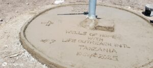 A circular concrete circle with writing on it AI-generated content may be incorrect.